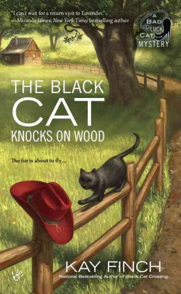 The black cat knocks on wood : a bad luck cat mystery / Kay Finch.