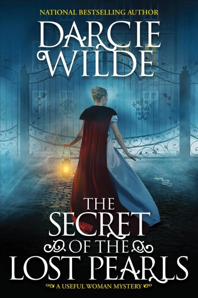The secret of the lost pearls / Darcie Wilde.